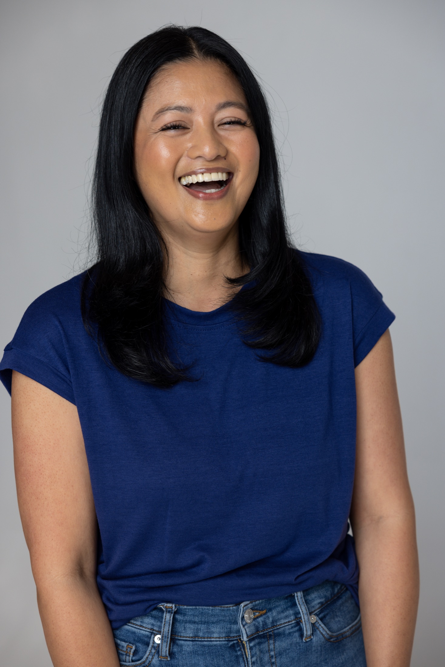 Original studio portrait of an ambassador in a blue top