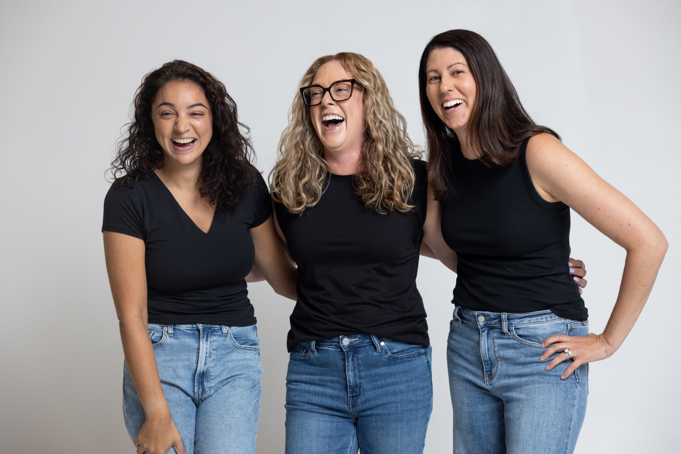 Three Midi participants laughing together in the studio